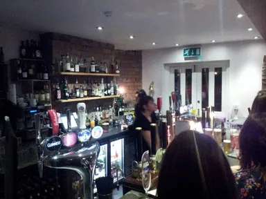 I reached over the teeming masses to get this action shot of the bar.