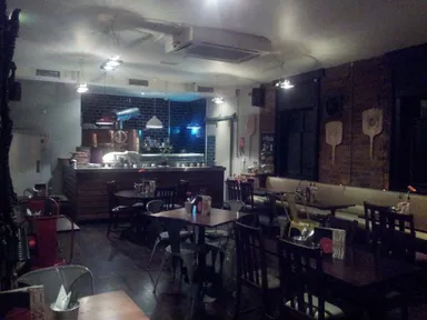 Dining room with the pizza oven at one end.
