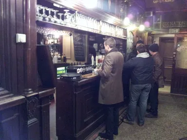 The main bar area is at the foot of the stairs.