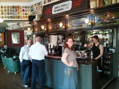 The sign above the bar gives away that this is no ordinary pub.