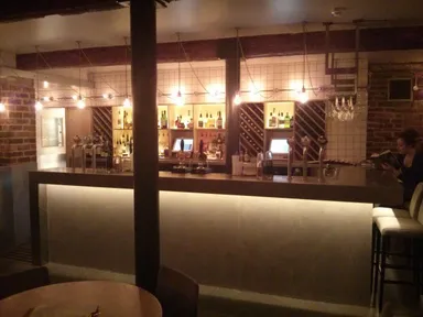 The bar. Sit down, it's table service.
