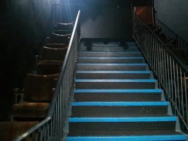 Some disused cinema seats make for an eerie abandoned feeling on the way in.