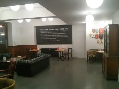 I think it's all the white fluorescent light and white walls that make it feel a bit cold to me. But the sofas are lovely!