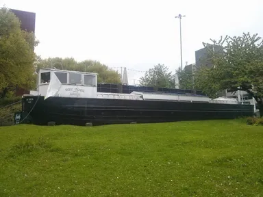 A boat on a traffic island. Not something you see every day.