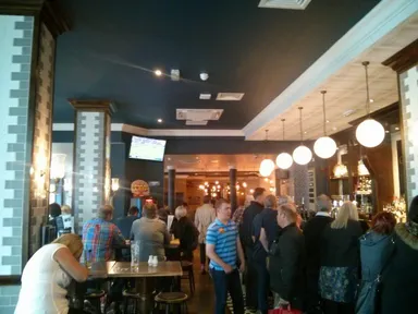 Lots of people watching the football.