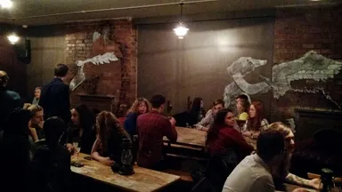 Upstairs artwork. Plenty of seating here now that awful square bar is gone!