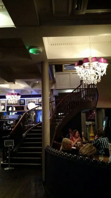 Spiral staircase and the ubiquitous Yates's chandelier.