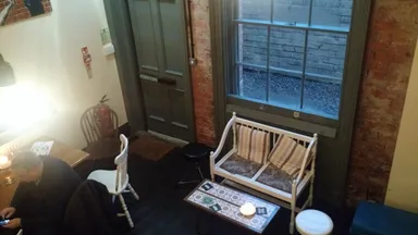 Some of the downstairs tables near the piano.