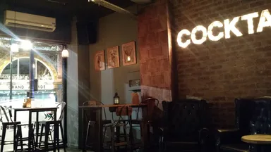 Cocktails! Says so right on the wall. In lights.